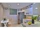 Bright kitchen featuring stainless steel appliances and a cozy breakfast nook at 4620 Riverwalk Village Ct # 7306, Ponce Inlet, FL 32127