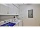 Practical laundry room with modern washer and dryer units for convenient chores at 4620 Riverwalk Village Ct # 7306, Ponce Inlet, FL 32127