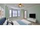 Well-lit main bedroom featuring multiple windows and a comfortable sleeping area at 4620 Riverwalk Village Ct # 7306, Ponce Inlet, FL 32127