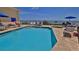 Inviting pool area with lounge chairs and stunning ocean views, perfect for relaxation at 4620 Riverwalk Village Ct # 7306, Ponce Inlet, FL 32127