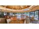 Bright recreation room featuring a pool table, ping pong table, seating and views of the community pool at 4620 Riverwalk Village Ct # 7306, Ponce Inlet, FL 32127