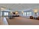 Spacious recreation room with ping pong table, comfortable seating, and abundant natural light at 4620 Riverwalk Village Ct # 7306, Ponce Inlet, FL 32127