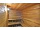 Warm wooden sauna with multi-tiered seating for relaxation and wellness at 4620 Riverwalk Village Ct # 7306, Ponce Inlet, FL 32127