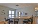 Well-maintained wet bar with seating, sink, and artwork perfect for serving refreshments and gathering at 4620 Riverwalk Village Ct # 7306, Ponce Inlet, FL 32127