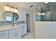 Modern bathroom featuring white cabinets, a quartz countertop, decorative tiling, and a glass enclosed shower at 475 Spruceview Dr, Port Orange, FL 32127