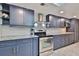 Updated kitchen featuring stainless steel appliances, modern cabinetry, tile backsplash, and a stainless steel range hood at 475 Spruceview Dr, Port Orange, FL 32127