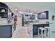 Modern kitchen featuring blue cabinets, stainless steel appliances, a spacious island, and a skylight at 475 Spruceview Dr, Port Orange, FL 32127