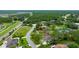 This shot highlights the property's location near a lush, green forested area at 484 Sweet Bay Ave, New Smyrna Beach, FL 32168