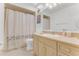 Simple bathroom with a shower, standard-sized toilet, sink, and storage beneath the counter at 484 Sweet Bay Ave, New Smyrna Beach, FL 32168