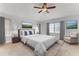 Comfortable bedroom with a large window, neutral decor, and stylish furnishings at 484 Sweet Bay Ave, New Smyrna Beach, FL 32168
