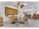 Elegant dining area with modern furniture, a stylish buffet, and an open view to the kitchen at 484 Sweet Bay Ave, New Smyrna Beach, FL 32168