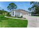 Charming one-story home featuring a three-car garage, well-manicured lawn and fresh landscaping at 484 Sweet Bay Ave, New Smyrna Beach, FL 32168