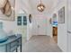 Bright foyer with tile flooring, arched doorways, decorative lighting, and views into adjacent rooms at 484 Sweet Bay Ave, New Smyrna Beach, FL 32168