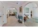 Bright foyer with tile flooring, arched doorways, decorative lighting, and views into adjacent rooms at 484 Sweet Bay Ave, New Smyrna Beach, FL 32168