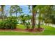 Well-maintained front yard showcasing lush landscaping and a welcoming facade at 484 Sweet Bay Ave, New Smyrna Beach, FL 32168