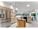Bright, open kitchen with stainless steel appliances, an island, and ample natural light at 484 Sweet Bay Ave, New Smyrna Beach, FL 32168