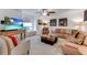 Comfortable living room featuring stylish furniture, a large TV, and a cozy seating area at 484 Sweet Bay Ave, New Smyrna Beach, FL 32168