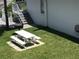 Charming exterior with picnic table and grassy lawn for outdoor enjoyment at 4849 Saxon # C202, New Smyrna Beach, FL 32169