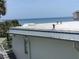 Relaxing ocean view from rooftop with blue skies on a sunny day provides perfect backdrop for beachside living at 4849 Saxon # C202, New Smyrna Beach, FL 32169