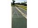 Outdoor community shuffleboard courts with game markings and numbered play areas at 4849 Saxon # C202, New Smyrna Beach, FL 32169