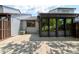 Spacious back patio area with a screened-in porch, perfect for outdoor relaxation and entertaining at 488 Shorewood Ln, New Smyrna Beach, FL 32168