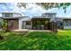 The back patio offers an enclosed lanai and fenced yard at 488 Shorewood Ln, New Smyrna Beach, FL 32168
