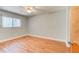 Bedroom with laminate floors, ceiling fan, and a door leading out of the room at 488 Shorewood Ln, New Smyrna Beach, FL 32168