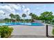 Inviting community pool area with palm trees, offering a relaxing and refreshing outdoor experience at 488 Shorewood Ln, New Smyrna Beach, FL 32168