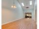 Spacious living room featuring high ceilings, a ceiling fan, and sliding doors to the backyard at 488 Shorewood Ln, New Smyrna Beach, FL 32168