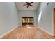 Spacious living room featuring high ceilings, a ceiling fan, and sliding doors to the backyard at 488 Shorewood Ln, New Smyrna Beach, FL 32168