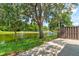 Picturesque pond view with mature trees and a fountain, offering a peaceful and inviting natural setting at 488 Shorewood Ln, New Smyrna Beach, FL 32168