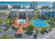 High aerial view of condos, tennis courts, and a pool near the beach at 5300 S Atlantic Ave # 1-603, New Smyrna Beach, FL 32169