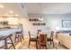 Cozy dining area with breakfast bar and views of updated kitchen and living room at 5300 S Atlantic Ave # 1-603, New Smyrna Beach, FL 32169