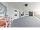 View of building exterior featuring ample seating and tables on a covered patio at 5300 S Atlantic Ave # 1-603, New Smyrna Beach, FL 32169