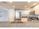 Charming kitchen featuring stainless steel appliances, granite countertops, and ample white cabinetry at 5300 S Atlantic Ave # 1-603, New Smyrna Beach, FL 32169