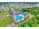 Wonderful aerial view of the community pool, tennis courts and landscaping at 534 Stowers Dr, New Smyrna Beach, FL 32168