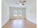 This bedroom features natural light and wood-look floors at 534 Stowers Dr, New Smyrna Beach, FL 32168