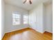 Bright bedroom with wood-look flooring, featuring two large windows at 534 Stowers Dr, New Smyrna Beach, FL 32168