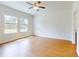 This bedroom features natural light and wood-look floors at 534 Stowers Dr, New Smyrna Beach, FL 32168