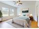 Bright bedroom with a comfortable bed, chic lamps, and light-filled windows, creating restful ambiance at 534 Stowers Dr, New Smyrna Beach, FL 32168
