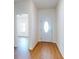 Bright foyer with wood-look flooring, leading to other areas of the home at 534 Stowers Dr, New Smyrna Beach, FL 32168