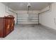 Large garage with overhead door and vintage armoire for storage at 534 Stowers Dr, New Smyrna Beach, FL 32168
