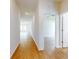 Hallway featuring wood-look flooring, connecting the living spaces and bedrooms at 534 Stowers Dr, New Smyrna Beach, FL 32168