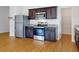 This kitchen features stainless steel appliances, granite countertops, and dark wood cabinets at 534 Stowers Dr, New Smyrna Beach, FL 32168