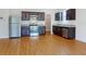 Well-equipped kitchen boasting granite countertops, stainless steel appliances, and hardwood floors at 534 Stowers Dr, New Smyrna Beach, FL 32168