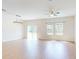 This living room features natural light and wood-look floors at 534 Stowers Dr, New Smyrna Beach, FL 32168