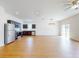 This living room features stainless steel appliances, granite countertops, and dark wood cabinets at 534 Stowers Dr, New Smyrna Beach, FL 32168