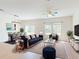 Stylish living room featuring blue sofa, modern decor, and neutral rug that complements open living space at 534 Stowers Dr, New Smyrna Beach, FL 32168