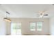 Living room featuring sliding glass doors, natural light, and hardwood floors at 534 Stowers Dr, New Smyrna Beach, FL 32168