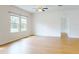 Bright living area with hardwood floors, natural light, and access to hallway at 534 Stowers Dr, New Smyrna Beach, FL 32168